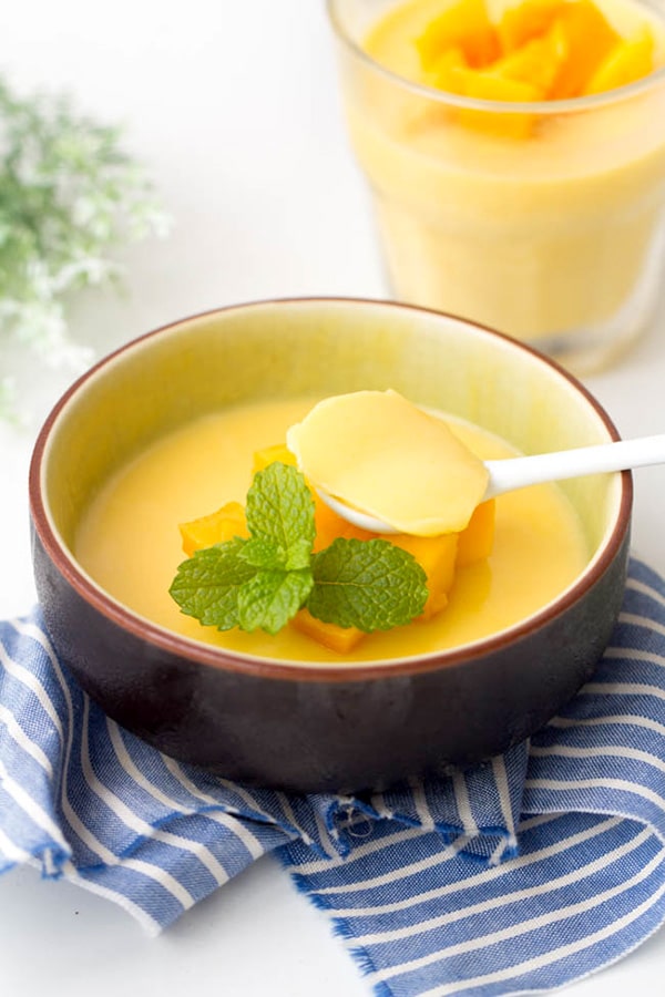 mango pudding with mint garnish on top