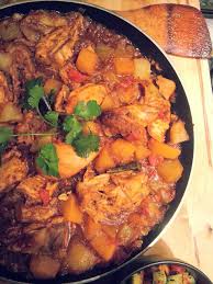 A clustered Durban curry of chicken, potatoes, tomatoes, ginger, garlic, and ground spices