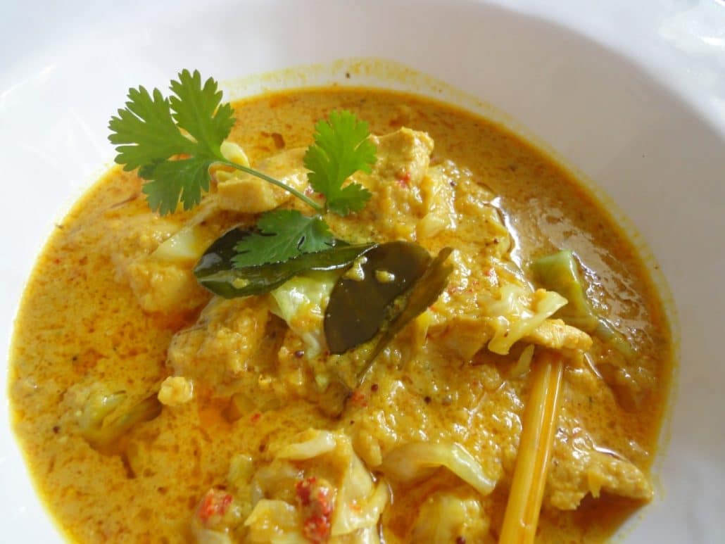 A creamy yellow curry with chicken, lemongrass, and candlenuts