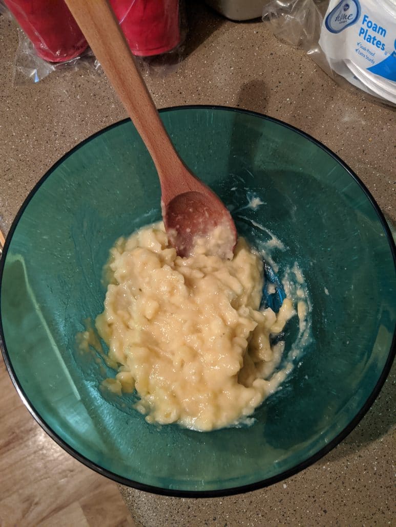 Mashed bananas in a large mixing bowl