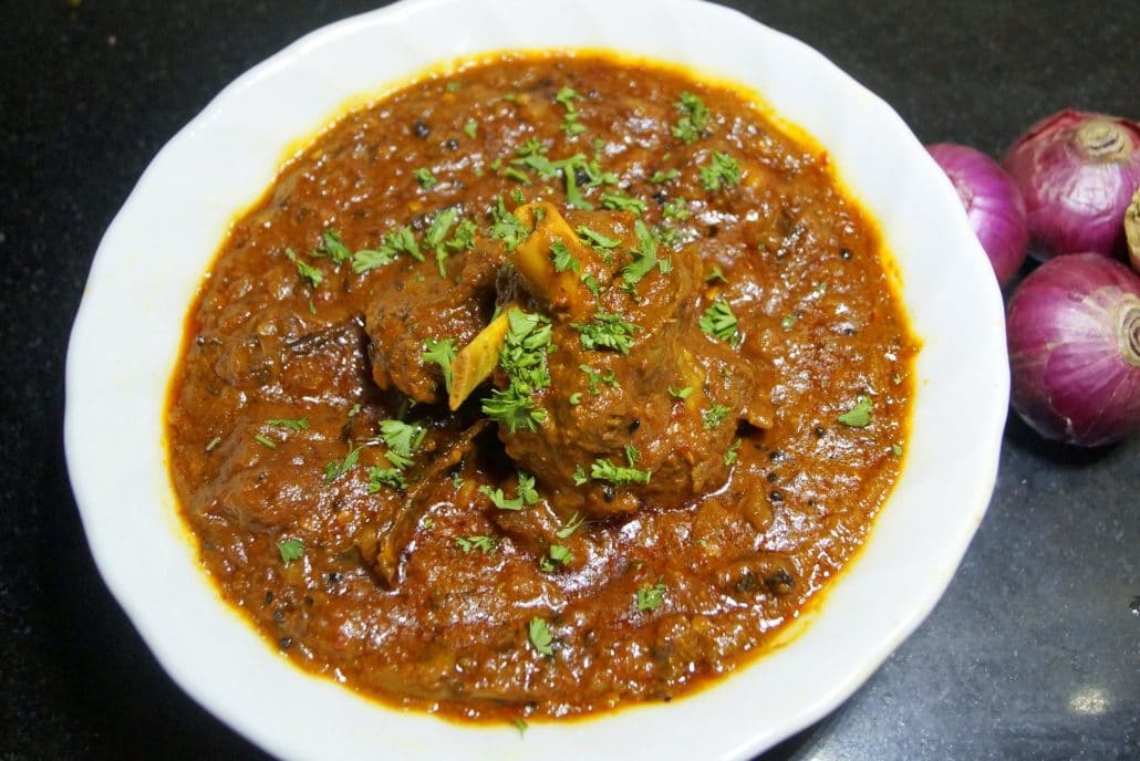 A fiery red Nepalese lamb curry, called khasi ko masu