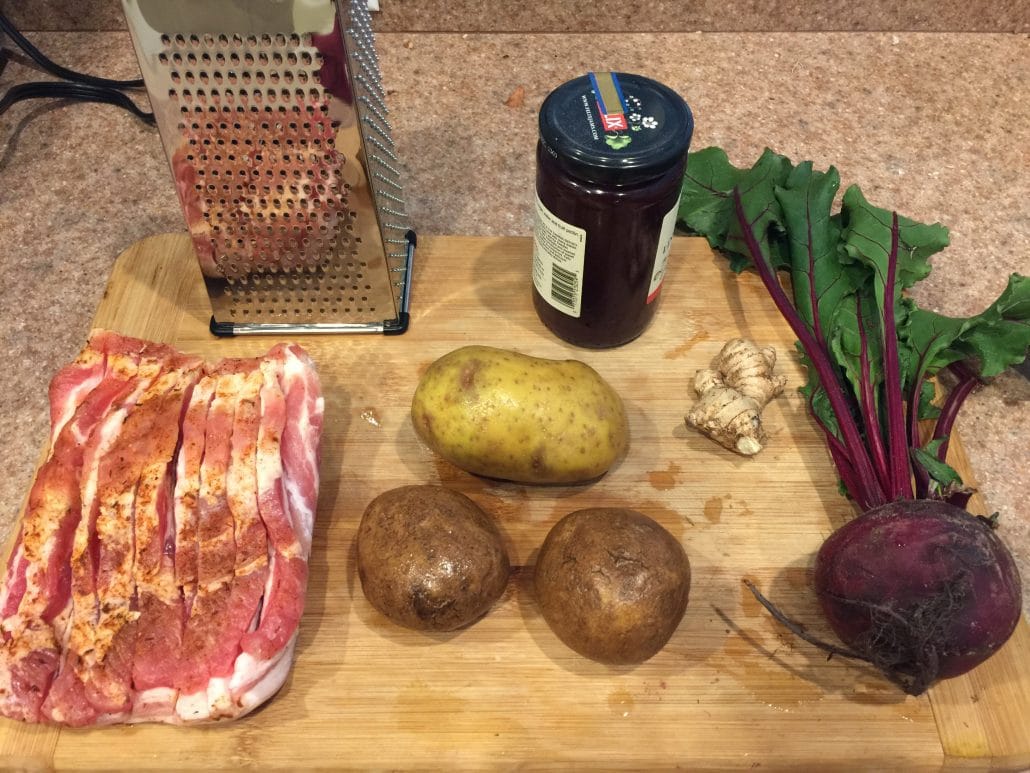 Pork belly, potatoes, ginger, a beet, lingonberry jam, and a grater