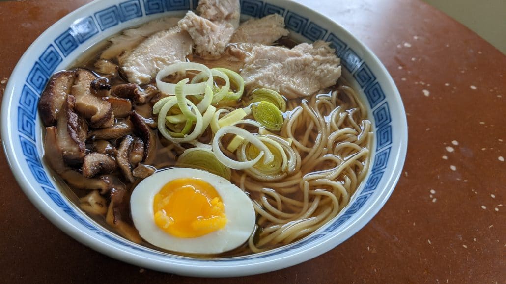 A bowl of turkey ramen with a shoyu broth.