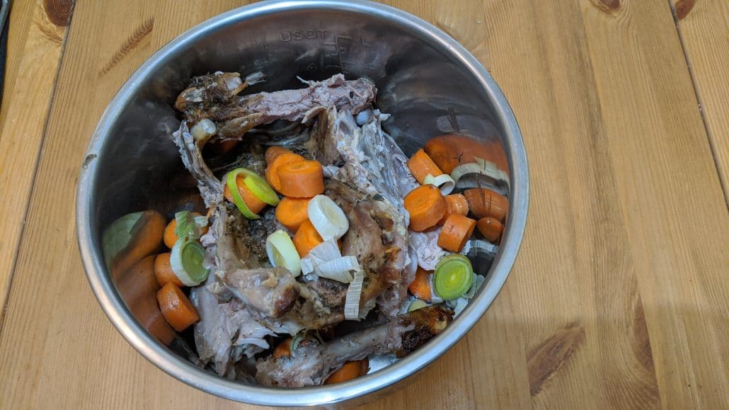 Turkey carcass in an Instant Pot with carrots and leek.