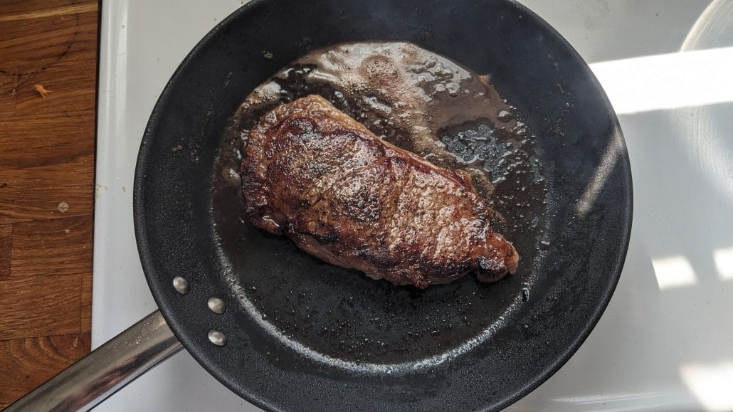 Cooked sirloin steak in a skillet